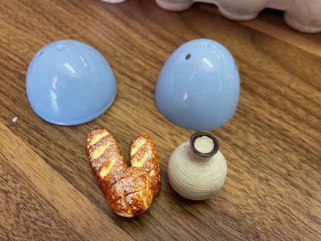 A piece of bread and a small cup — symbols of communion